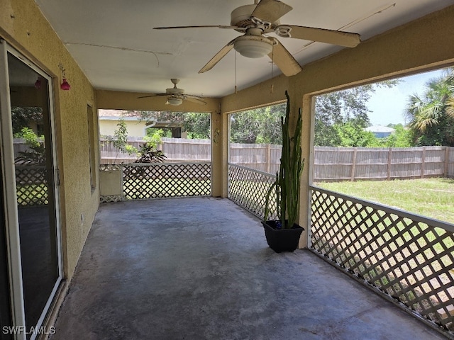 3022 34th St SW, Lehigh Acres, FL 33976 - unfurnished sunroom featuring a ceiling fan