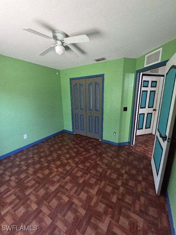 3022 34th St SW, Lehigh Acres, FL 33976 - unfurnished room with baseboards and ceiling fan