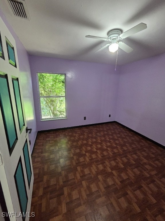 3022 34th St SW, Lehigh Acres, FL 33976 - spare room featuring ceiling fan and baseboards