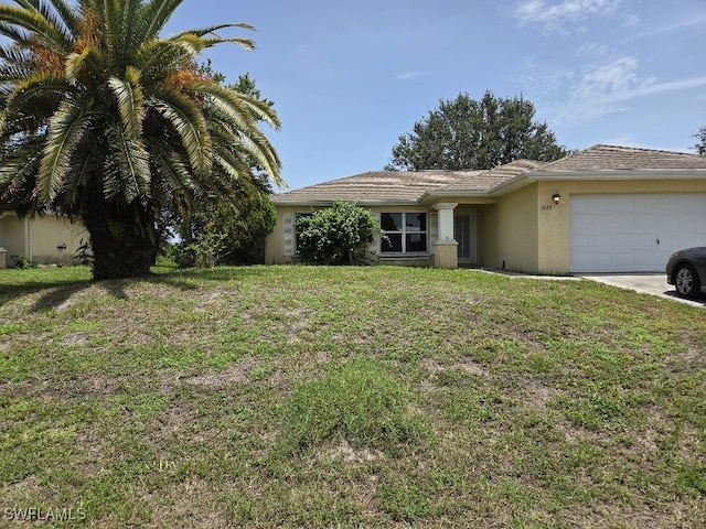 3022 34th St SW, Lehigh Acres, FL 33976 - single story home with stucco siding, an attached garage, a front yard, and driveway