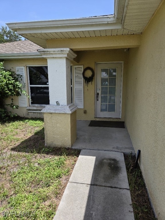 3022 34th St SW, Lehigh Acres, FL 33976 - entrance to property with stucco siding