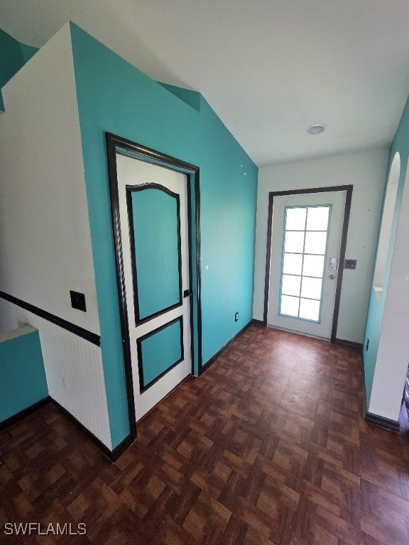 3022 34th St SW, Lehigh Acres, FL 33976 - spare room featuring wainscoting and lofted ceiling