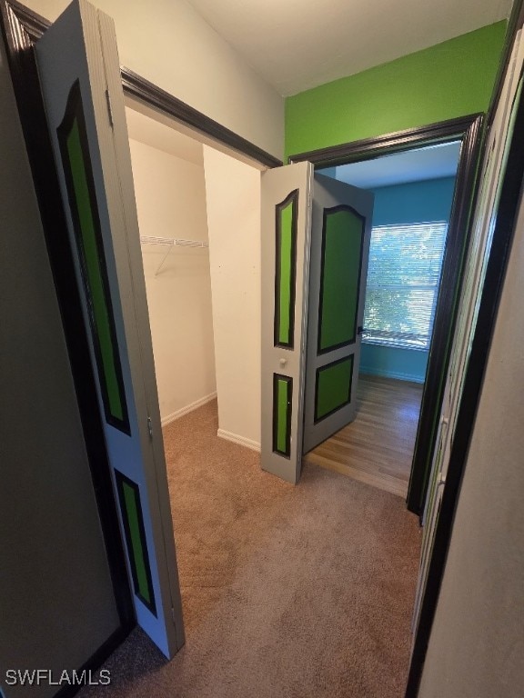 3022 34th St SW, Lehigh Acres, FL 33976 - corridor with carpet and baseboards