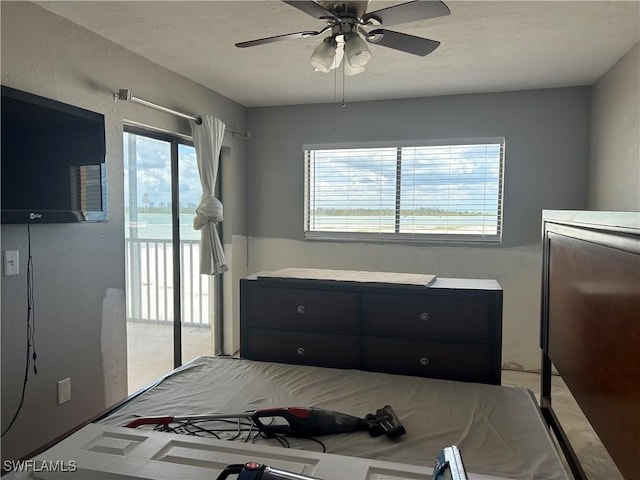 8350 Estero Blvd Unit 235, Fort Myers Beach, FL 33931 - bedroom with access to exterior, multiple windows, and ceiling fan