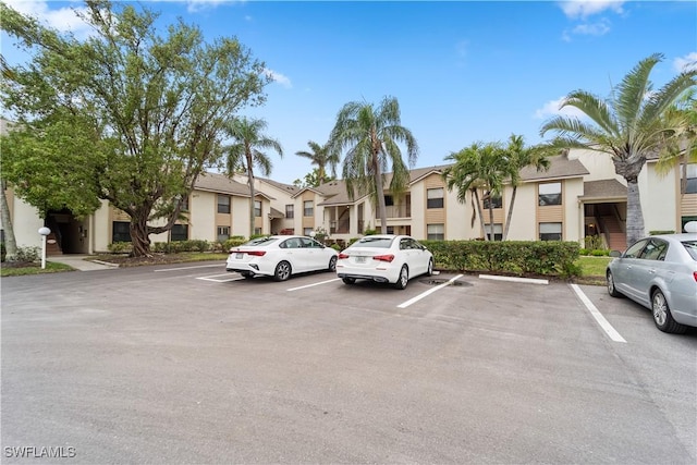5487 Peppertree Dr Unit 5, Fort Myers, FL 33908 - uncovered parking lot with a residential view