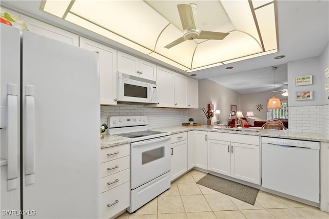 5487 Peppertree Dr Unit 5, Fort Myers, FL 33908 - kitchen with white appliances, tasteful backsplash, a ceiling fan, light tile patterned floors, and white cabinets