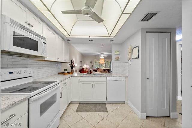 5487 Peppertree Dr Unit 5, Fort Myers, FL 33908 - kitchen featuring ceiling fan, white appliances, light tile patterned floors, backsplash, and white cabinetry