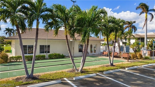 5487 Peppertree Dr Unit 5, Fort Myers, FL 33908 - view of building exterior with uncovered parking