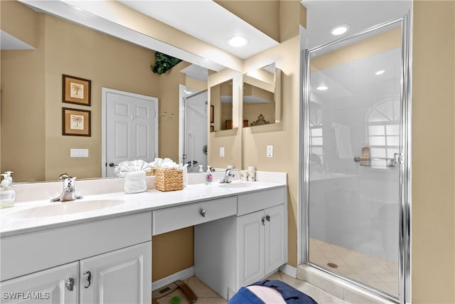 1057 Silverstrand Dr, Naples, FL 34110 - full bath featuring double vanity, a shower stall, recessed lighting, and tile patterned flooring