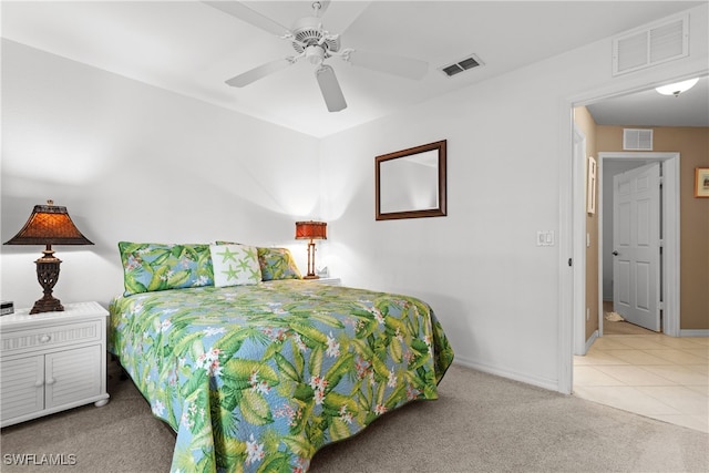 1057 Silverstrand Dr, Naples, FL 34110 - bedroom with carpet floors and ceiling fan