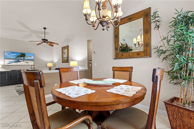 1057 Silverstrand Dr, Naples, FL 34110 - dining room with a chandelier, light tile patterned flooring, and a ceiling fan