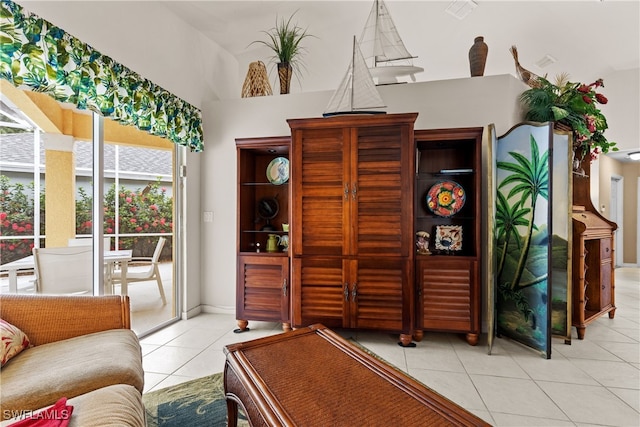 1057 Silverstrand Dr, Naples, FL 34110 - living area with light tile patterned floors and healthy amount of natural light
