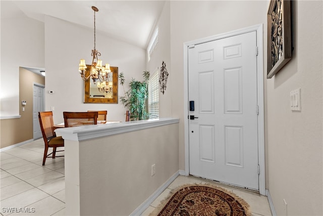 1057 Silverstrand Dr, Naples, FL 34110 - entrance foyer featuring a chandelier and high vaulted ceiling