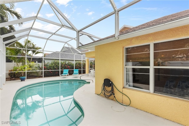 1057 Silverstrand Dr, Naples, FL 34110 - swimming pool featuring a patio area and glass enclosure