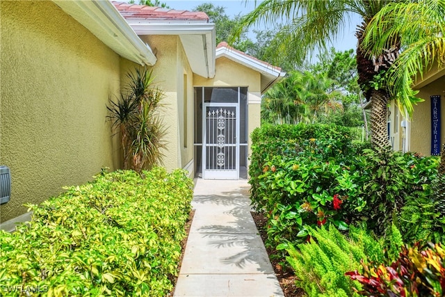 4776 Fairloop Run, Lehigh Acres, FL 33973 - entrance to property with stucco siding