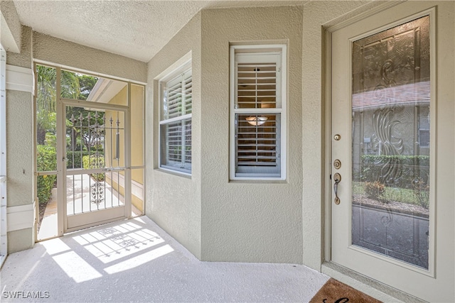 4776 Fairloop Run, Lehigh Acres, FL 33973 - view of exterior entry with stucco siding