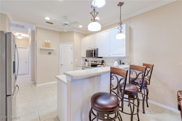 4776 Fairloop Run, Lehigh Acres, FL 33973 - kitchen with stainless steel appliances, a peninsula, light countertops, crown molding, and ceiling fan