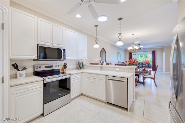 4776 Fairloop Run, Lehigh Acres, FL 33973 - kitchen featuring appliances with stainless steel finishes, ornamental molding, ceiling fan, a peninsula, and white cabinets