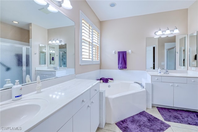 4776 Fairloop Run, Lehigh Acres, FL 33973 - bathroom with a stall shower, two vanities, a garden tub, and tile patterned floors