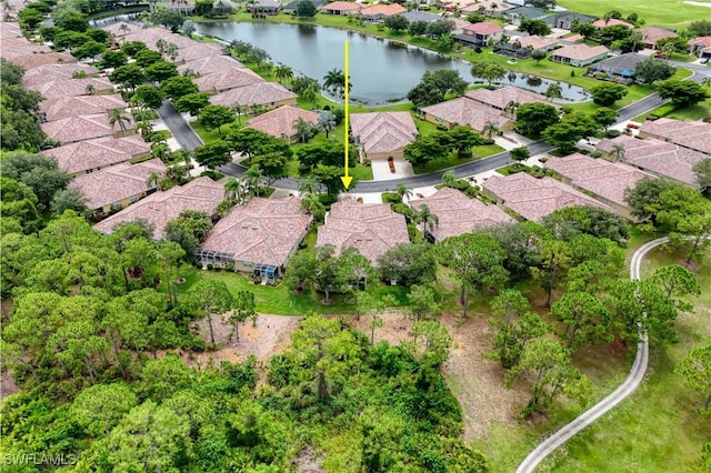 4776 Fairloop Run, Lehigh Acres, FL 33973 - aerial overview of property's location with a large body of water and nearby suburban area