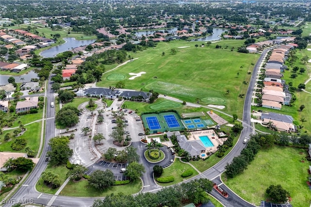 4776 Fairloop Run, Lehigh Acres, FL 33973 - aerial view of property and surrounding area featuring a large body of water, nearby suburban area, and a golf course