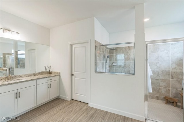 1801 Hagen Ct, Naples, FL 34120 - full bath with vanity, a tile shower, and wood finished floors