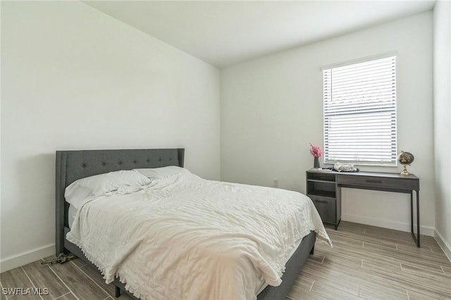 1801 Hagen Ct, Naples, FL 34120 - bedroom with wood tiled floors and baseboards