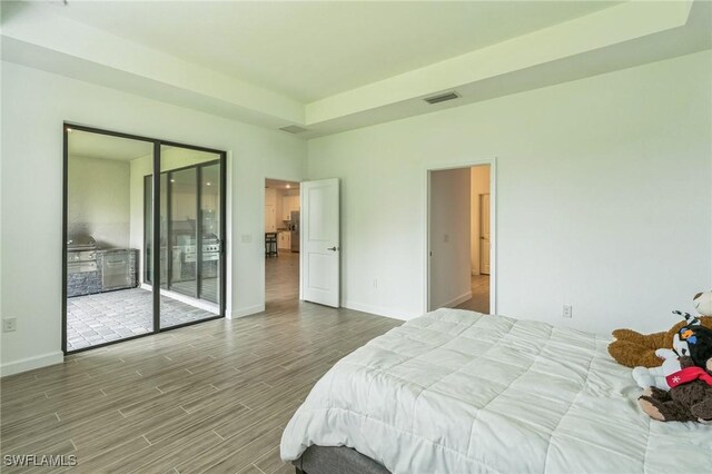 1801 Hagen Ct, Naples, FL 34120 - bedroom with wood finished floors and access to outside