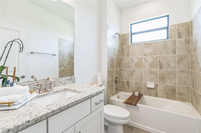 1801 Hagen Ct, Naples, FL 34120 - full bath with vanity, washtub / shower combination, and wood finished floors