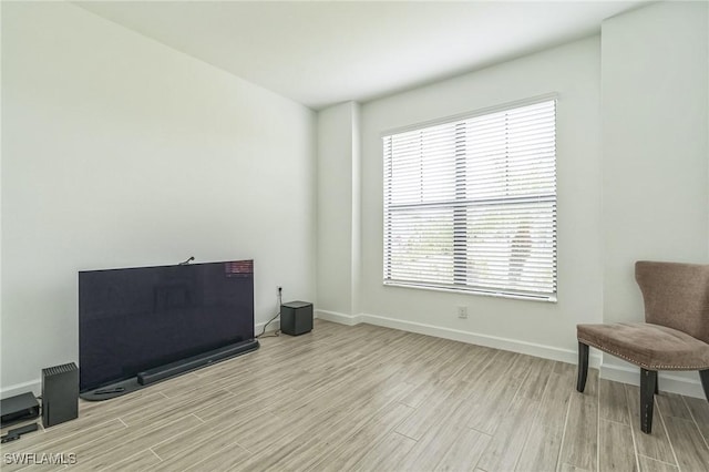 1801 Hagen Ct, Naples, FL 34120 - sitting room with light wood-type flooring and baseboards
