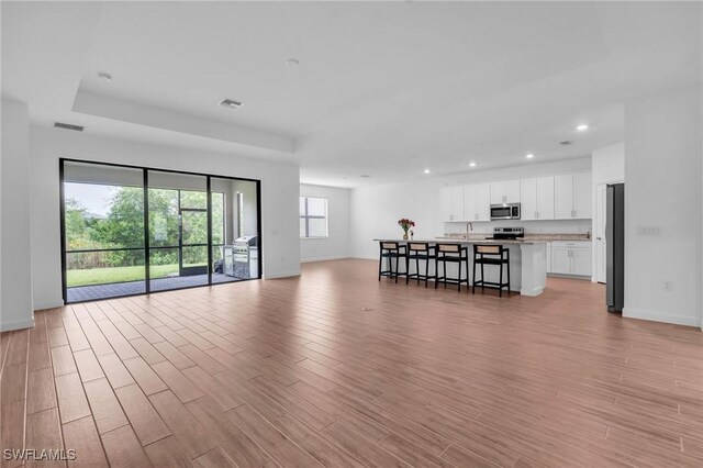 1801 Hagen Ct, Naples, FL 34120 - living area with recessed lighting and light wood-type flooring
