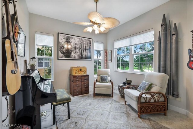 23751 Merano Ct Unit 201, Estero, FL 34134 - living area featuring baseboards and ceiling fan