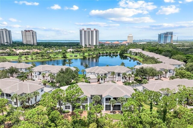 23751 Merano Ct Unit 201, Estero, FL 34134 - drone / aerial view of a nearby body of water and a tree filled landscape