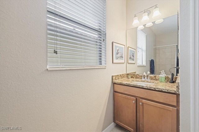 20333 Cypress Shadows Blvd, Estero, FL 33928 - bathroom featuring vanity, a textured wall, and a shower