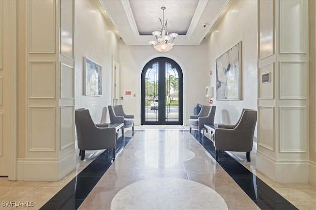 20333 Cypress Shadows Blvd, Estero, FL 33928 - foyer entrance with a chandelier, inlaid floor details, ornamental molding, french doors, and arched walkways