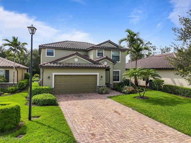20333 Cypress Shadows Blvd, Estero, FL 33928 - mediterranean / spanish-style home with decorative driveway, a front lawn, stucco siding, a tile roof, and a garage