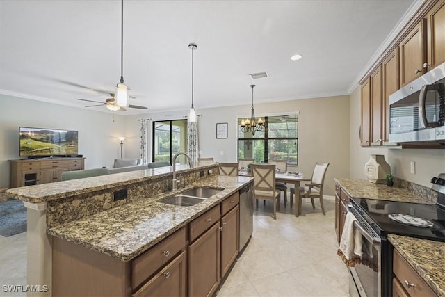20333 Cypress Shadows Blvd, Estero, FL 33928 - kitchen featuring appliances with stainless steel finishes, crown molding, a chandelier, decorative light fixtures, and healthy amount of natural light