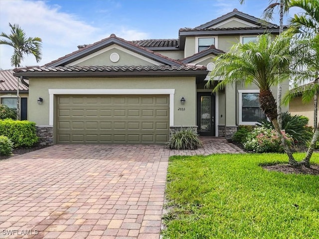 20333 Cypress Shadows Blvd, Estero, FL 33928 - view of front of house featuring stone siding, decorative driveway, stucco siding, a front lawn, and a garage