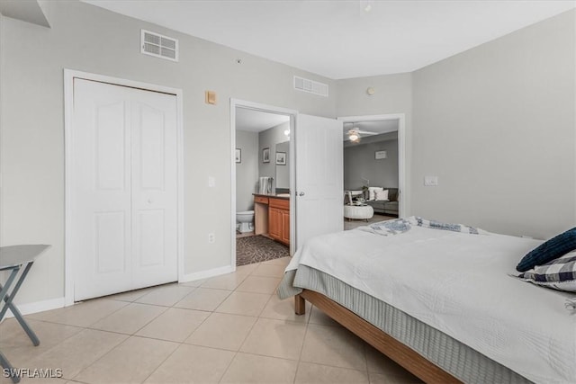 13010 Positano Cir Unit 206, Naples, FL 34105 - bedroom featuring light tile patterned floors and ensuite bath