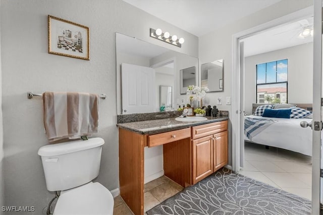 13010 Positano Cir Unit 206, Naples, FL 34105 - bathroom featuring vanity, connected bathroom, and tile patterned flooring