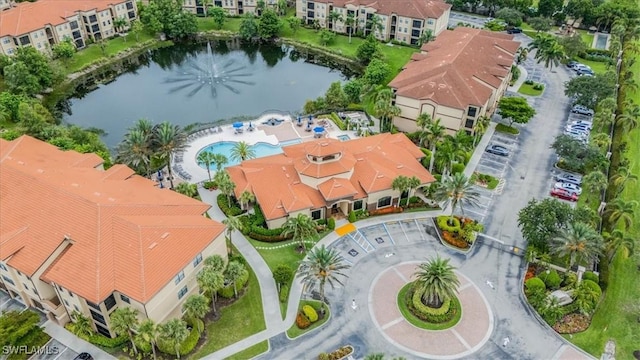 13010 Positano Cir Unit 206, Naples, FL 34105 - drone / aerial view of a pool area and a large body of water