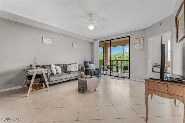 13010 Positano Cir Unit 206, Naples, FL 34105 - living area with ceiling fan and light tile patterned flooring