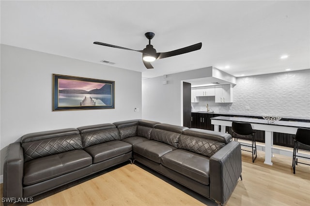 610 SW 47th Ter Unit 2, Cape Coral, FL 33914 - living area with light wood-style floors, ceiling fan, and wet bar