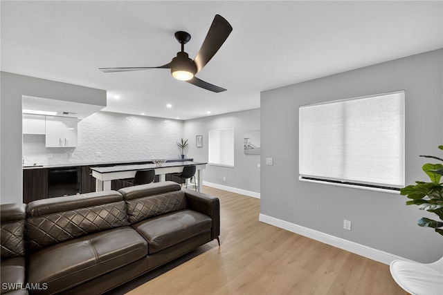 610 SW 47th Ter Unit 2, Cape Coral, FL 33914 - living room featuring a ceiling fan, light wood-style floors, and recessed lighting