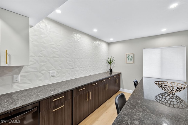 610 SW 47th Ter Unit 2, Cape Coral, FL 33914 - kitchen featuring light wood-type flooring, dark stone countertops, tasteful backsplash, recessed lighting, and dishwasher