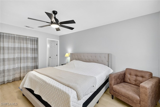 610 SW 47th Ter Unit 2, Cape Coral, FL 33914 - bedroom with light wood finished floors and ceiling fan