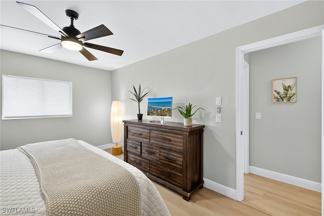 610 SW 47th Ter Unit 2, Cape Coral, FL 33914 - bedroom with light wood-type flooring and a ceiling fan
