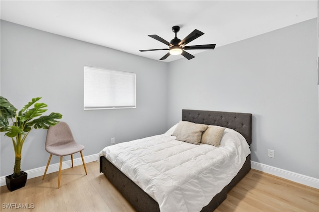 610 SW 47th Ter Unit 2, Cape Coral, FL 33914 - bedroom featuring wood finished floors and a ceiling fan