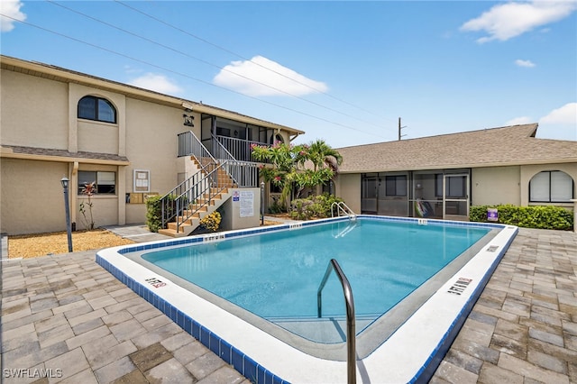 610 SW 47th Ter Unit 2, Cape Coral, FL 33914 - community pool with stairway and a sunroom