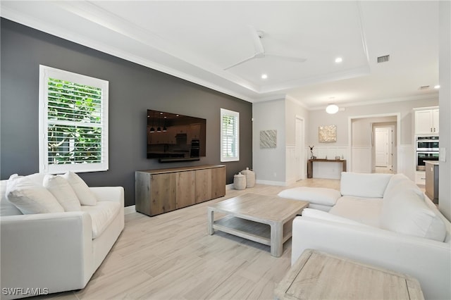 8951 Saint Lucia Dr, Naples, FL 34114 - living room featuring ceiling fan, plenty of natural light, recessed lighting, a tray ceiling, and ornamental molding